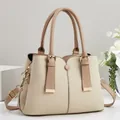 Detailed side view of beige contrast color large capacity soft leather tote bag for women - Patchwork Contrast Style / Khaki