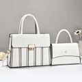 Elegant set of two white minimalist flap handbags with premium gold-tone hardware detail - 30x11x23cm / White