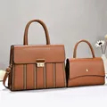 Elegant set of two brown leather handbags featuring textured stripes and gold-tone clasps - 30x11x23cm / Earthy Yellow