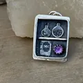 Vintage oxidized silver magic book pendant featuring purple gemstone and potion bottles - Box