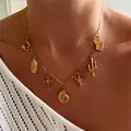 Elegant 18K gold-plated DIY charm necklace featuring a cross, shell, and unique pendants - Ocean Necklace (T236_22) / Gold