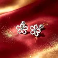Elegant silver flower stud earrings in titanium steel with screw backs on red satin - Silver Hollow Flower Screw Ball (Single)