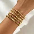 Set di cinque braccialetti di perline dorate in forme tonde e quadrate per donna. - Set da 5 Pezzi Oro (A-1088)
