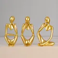 Set aus drei goldenen abstrakten Denkerstatuen aus Harz mit Maßen für die Dekoration von Regalen - 7128p-01 golden character three-piece set packaging