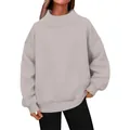 Close-up detail of a comfortable beige oversized turtleneck sweatshirt for women. - Space Gray