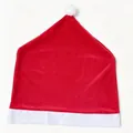 Festive red and white Santa hat chair cover for Christmas dining room home decor - Golden Velvet Chair Cover