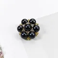 Elegante bottone a fiore in perla nera con base in metallo dorato e accenti di cristalli - 18mm / Nero Oro