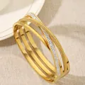 Meerlaagse kruislingse 18K vergulde titanium stalen armband met glanzende strasstenen - Goud