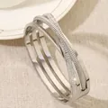 Elegante meerlaagse zilveren titanium stalen armband met fonkelende kristallen pave details - Zilver