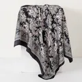 Elegant 90x90cm black paisley satin square scarf draped gracefully on a white pedestal. - 90x90cm / Black
