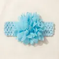Close-up detail of a soft light blue chiffon flower on a stretchy baby elastic headband - Blue