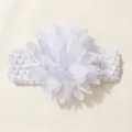 Detailed view of the delicate white chiffon flower on a stretchy knit baby headband - White