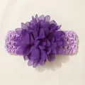 Macro detail of a purple chiffon flower on a soft elastic baby headband. - Deep purple