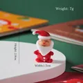 Handgemaakte glazen kerstman figuur voor sfeervolle kerstversiering op het bureau - Glimlachende Kerstman