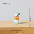 Handgemaakte glazen sneeuwpop figuur met groene hoed, hoogte 2,5cm, gewicht 7g. - Groengehoede Sneeuwpop 2.5cm