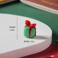 Handgemaakt groen glazen kerstcadeau-ornament met een decoratieve rode strik erop - Groene Cadeaudoos