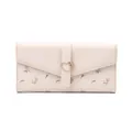 Detail of cream PU leather long wallet with floral print and heart-shaped buckle. - Apricot