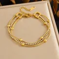 Elegant gold plated multilayer stainless steel bracelet decorated with clear rhinestones - Triple Layer Snake Chain Rhinestone (B2049) / Gold