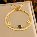 Elegant double-layer gold stainless steel bracelet with black and gold flower pendants - Double Snake Chain Black Enameled Flower (B2051) / Gold