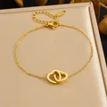 Elegant gold-plated stainless steel bracelet featuring interlocking double heart charms - Double Interlocking Heart Style (B2055) / Gold