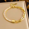 Gold-plated stainless steel bracelet featuring baguette CZ stones and a central lock charm. - Rhinestone Lock Splice Style (B2057) / Gold