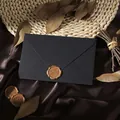 Detailed view of a vintage black textured envelope with a golden 'For You' wax seal - 1pc Linen Black Envelope + 1 Wax Seal / Black