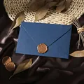 Close-up of a vintage navy blue linen envelope with a gold 'For You' wax seal - 1pc Linen Blue Envelope + 1 Wax Seal / Blue