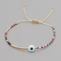 Handmade colorful seed bead bracelet with Evil Eye charm and adjustable beige string - Evil Eye Multicolor Seed Bead Style (MI-B200498A) / Multicolor (Evil Eye)