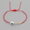 Handmade adjustable red cord bracelet featuring a white evil eye bead and gold bead accents - Red Rope Evil Eye Style (MI-B200498P) / Red (Evil Eye)