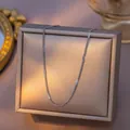 Minimalist silver steel lip chain necklace displayed on an elegant gold jewelry box - Flat Curb Chain (04) / 1 Piece Pack (40+5cm) / Steel