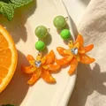 Vintage orange floral drop earrings with heart crystal and green beads for women - Orange Lily Earrings (2608059)