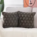 Set of two luxury dark gray quilted plush throw pillow covers displayed on a sofa - 18x18 Inch / Black Square