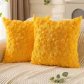 Pair of yellow plush quilted floral pillow covers displayed on a cream textured sofa - 45x45cm / Large Yellow Flower