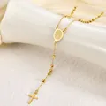 Close-up of a gold stainless steel rosary necklace with cross and medal detail. - Virgin Mary Style / 3mm Ball / Gold