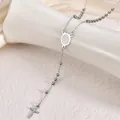 Close-up detail of stainless steel rosary necklace with Virgin Mary medal and cross - Virgin Mary Style / 3mm Ball / Steel