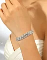 Silver finish tennis bracelet with full clear rhinestones shown on model wrist - White Silver Plated