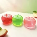 Macro view of three translucent apple-shaped squishy stress relief toys for desk - Apple Style (No Leaf) / Translucent