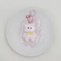 Jouet anti-stress en silicone en forme d'ours rose à rebond lent pour se détendre. - Ours à Cape / Rose
