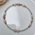 Detail of handmade freshwater pearl wire-wrapped bracelet with silver beads - Single Circle Seed Pearl Silver Bangle