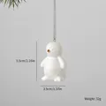 White ceramic penguin Christmas ornament pendant with silver hanging chain for tree decor - Penguin