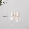 Elegant white ceramic bow Christmas tree ornament with gold trim and silver chain - Bow