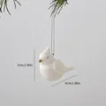 Elegant white ceramic bird Christmas tree ornament with golden beak and hanging string - Bird