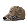Detailed side view of a vintage distressed washed denim baseball cap with white stitching. - M / Tan Denim Style