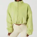 Detail of light green cropped fleece jacket with high collar and drawstring hem - S / Tops / Lime Green