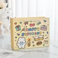 Close-up detail of a horizontal cartoon rabbit gift bag with colorful birthday illustrations - Small (19.5x8.5x14.5cm) / Yellow
