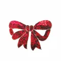 Detailed view of a red sequin bow patch decoration with 15.4cm x 10.9cm size markers - 10.9x15.4cm (With Adhesive)