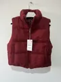 Detail view of a burgundy cable-knit padded vest with zipper and standing collar. - XS / Tops / Burgundy