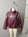 Detail view of stylish oversized burgundy faux leather jacket with elegant high neck collar - S / Tops / Burgundy