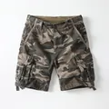 Vintage camouflage cargo shorts for men featuring a relaxed fit and utility pockets. - 38 / Bottoms / Desert Camouflage