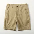 Men's vintage khaki cotton chino shorts, featuring a relaxed fit and durable stitching details. - Dark Khaki